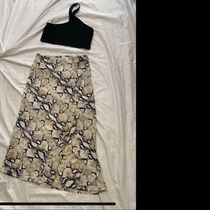 Cross body crop top. Black. Polyester/Rayon Viscose. Size M. Like new.